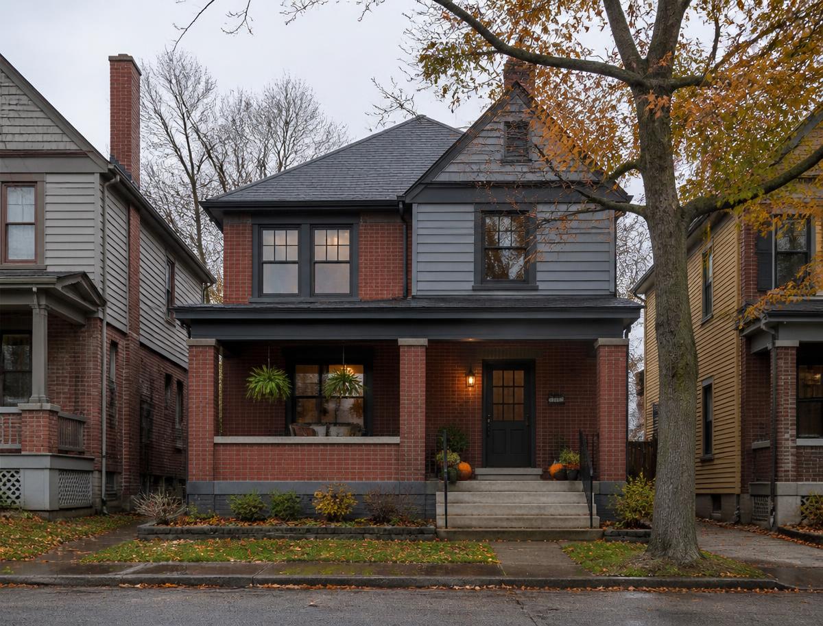 Freshly painted brick and clapboard home on a Western Pennsylvania street